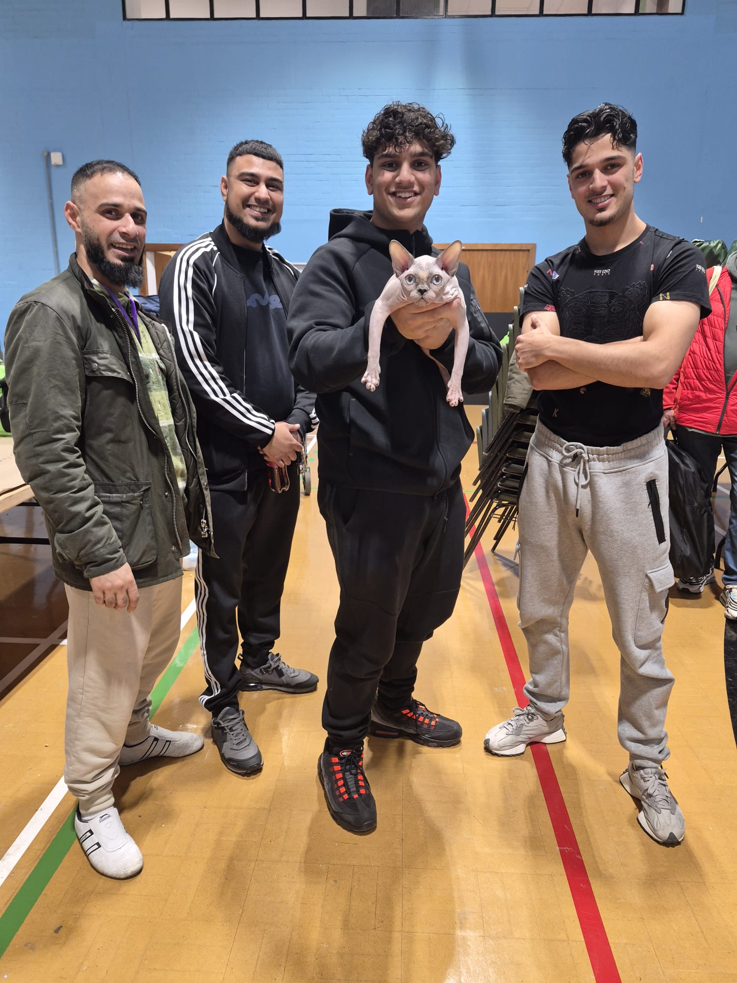 Friends from Scotish Angels, aka The Bradford massive, holding a Sphynx at a cat show